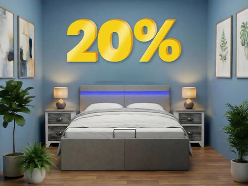 Banner com um desconto de "20%" em grandes n&uacute;meros amarelos 3D sobre um quarto moderno com uma cama cinzenta, paredes azuis e plantas de cabeceira. Clique para ver los productos de la cole&ccedil;&atilde;o.