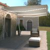 vidaXL Toldo retrátil manual com LED 600x350 cm cor creme