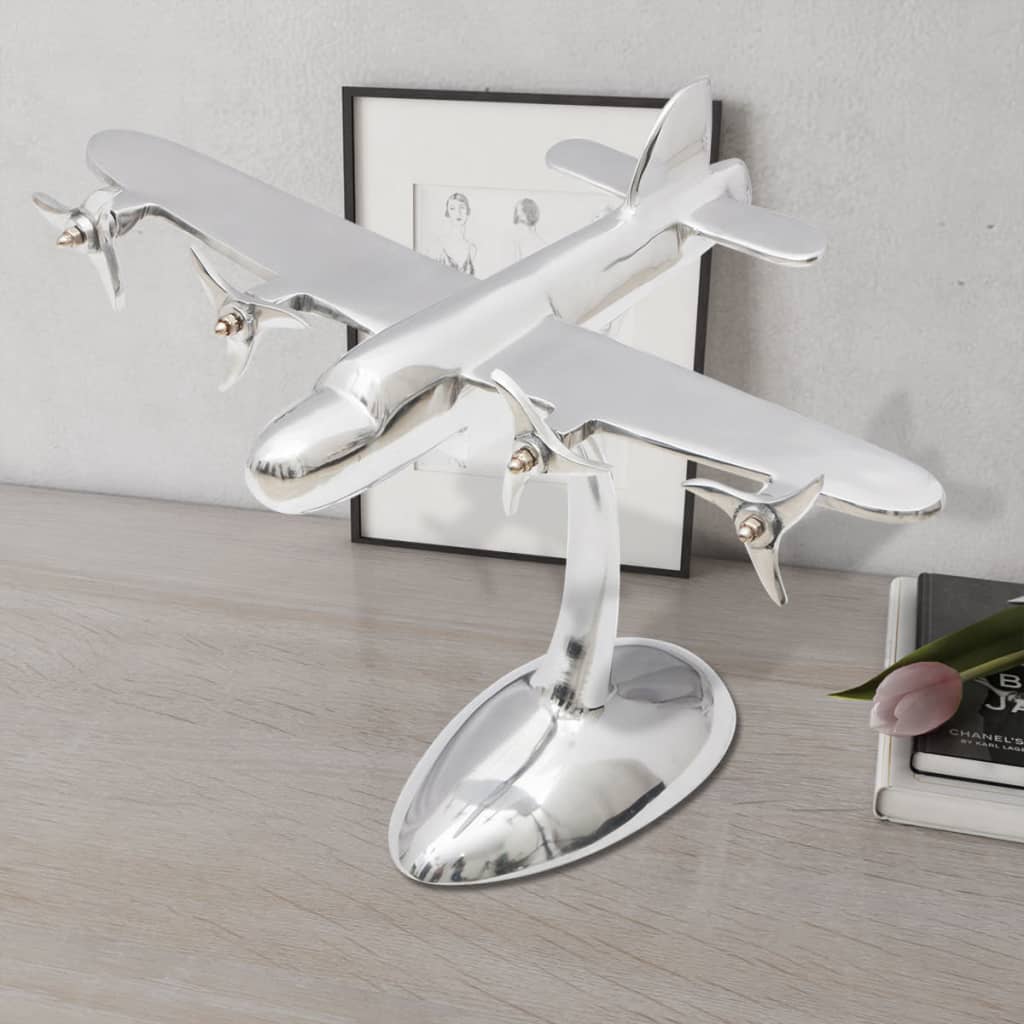 Modelo de avião em alumínio para decoração da área de trabalho